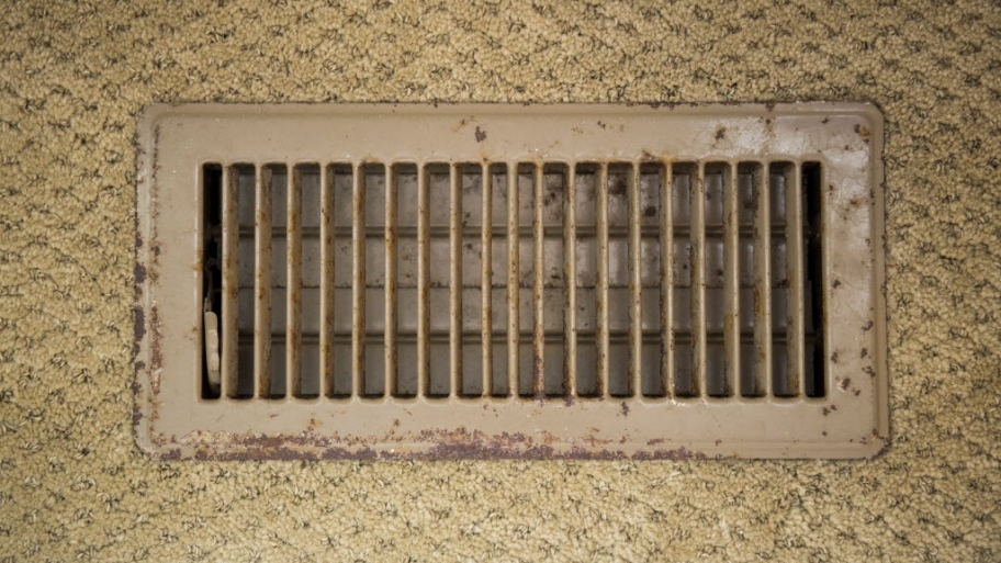 Air duct vent with carpet around it